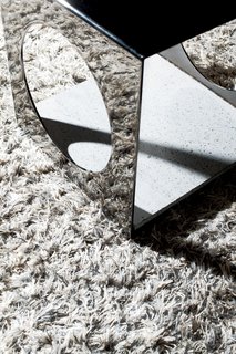 A Traditional Home and an Impeccable Eye - Photo 5 of 8 - A highly reflective Munch table by Rodolfo Dordoni for Minotti doubles the impact of the Fogg rug by Gunilla Lagerhem Ullberg for Kasthall.
