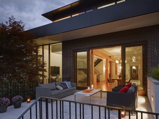 Smart Tech Makes this Modern Home Ultra Energy Efficient - Photo 10 of 11 - A deck is located off the dining area.