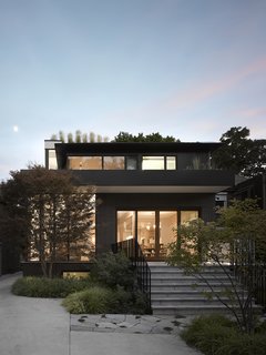 Smart Tech Makes this Modern Home Ultra Energy Efficient - Photo 11 of 11 - The majority of windows are on the south facade to optimize solar gain.