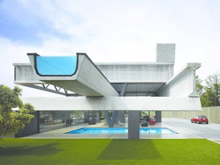 In Madrid, Spain, a house constructed of seven distinct pieces of precast concrete beams worked together to create this residence by Spanish firm Ensamble Studio. The elements were repurposed from highway construction, with beams projecting out and functioning at times as both structural and programmatic elements—like an infinity pool.