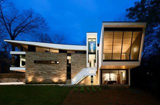 "So many houses seem like they’re completely still and heavy," says Dencity architect Staffan Svenson. Inspired by his client’s role in the airline industry, Svenson relished the chance to create a home that evokes motion and lightness.