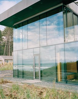 Architects Stan Boles and Christopher Almeida arranged ten-foot-tall panes of glass in a steel curtain-wall frame to create the building’s distinctive facade.