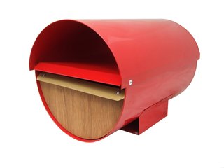 A powder-coated zinc aluminum body and marine plywood front means zero rust and mold from this New Zealand-made mailbox. A locked lower half keeps mail and packaged protected while the open upper half holds newspapers.