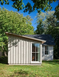Boards, Battens, and Bevels: Wood Board Siding Types and Their Uses - Photo 4 of 9 - The typical arrangement of board-and-batten siding (here, in painted white pine) consists of wider boards with narrower battens covering the joints.