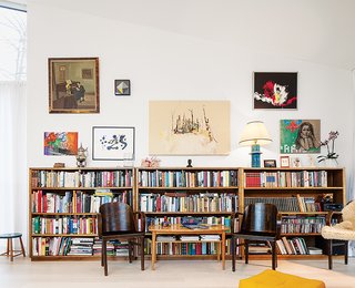 The bookshelves lining the walls of the living room were inherited from family.