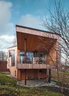 The exterior is clad in Siberian larch, which doesn’t require paint and will develop a gray patina.