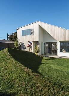 A Dramatic Cutout Wall and Other Surprises Define This Playful House - Photo 1 of 7 -