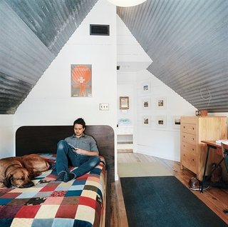 Newly minted college graduate Blake Dollahite saw an opportunity in this transitional time to build a foundation for his future. With a small bank loan and a lot of helping hands, Dollahite dove into his first year of freedom by shackling himself to a rundown Austin bungalow and preparing to make it home.<br><br>The bedroom, shown here, takes up the small second floor of the house.<br><br>Photo by: Misty Keasler
