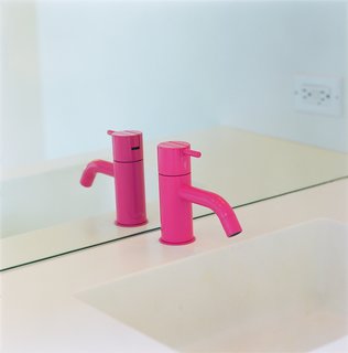 Eric Grunbaum added a hot pink powder-coated faucet by Vola for the downstairs bath in his Venice Beach home. Photo by Ye Rin Mok.