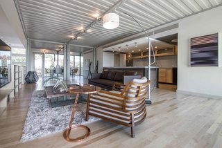 Corrugated steel ceilings are left exposed—a reminder that this is, after all, a container converted into a home. Spray foam insulation keeps the space from experiencing extreme temperature shifts.