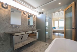 The industrial thread continues as a truck tool box converts into an elegant vanity in the master bathroom.