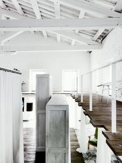 The double-height cabinets hold the residents’ clothing.