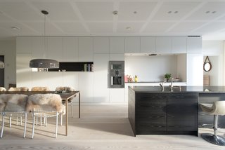 20 Best Modern Kitchen Counters - Photo 10 of 20 - Built-in kitchen cabinets and a monolithic island help keep the space uncluttered in this beautiful modern Scandinavian kitchen. The wall ovens are from Gaggenau.