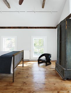Kartell’s 4801 chair occupies a corner of the master bedroom.