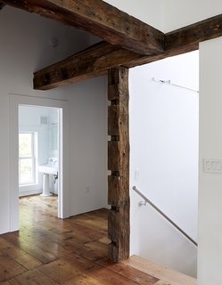 In the existing house, the wood beams were hidden under sheetrock and wallpaper. "I exposed them all, but I didn't let that dictate where the new walls would go," Givone says. "I let the beams fall where they may."