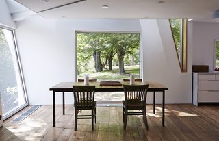 The kitchen, dining room, and living room are connected in an open-plan arrangement.