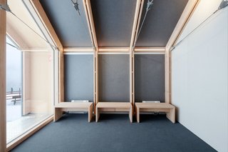 The building’s restrained color and material palettes carry over to the minimalist wood benches in the reception area. Since the facility must withstand heavy usage as well as inclement weather, it was built with "easy maintenance" in mind, according to Girodo.