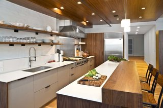 The refrigerator is Sub-Zero, the cooktop and hood are Viking, and the oven is Miele.
