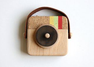Inspired by the photo sharing app Instagram, the nostalgic Anagram Wooden Camera, $35, sports the same striped colors (minus the blue) and is handmade from sustainable wood, cork, and leather.