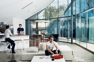 Rodriguez, a designer and architect who runs the studio Agi Miagi, created the pendant lamp and terrariums in the dining area. The space is open to the living area, where Brown’s son, Hugo, sits on a Living Divani sofa. The countertop-table is by Bercy Chen Studio.