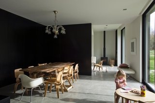 The downstairs area is floored in polished concrete, and flanked on the north side by huge full-height windows through which passive heat is gathered. The majority of the winter heating, however, is from a ground source heat pump that uses the latent energy in the earth — a relatively new solution in New Zealand.
