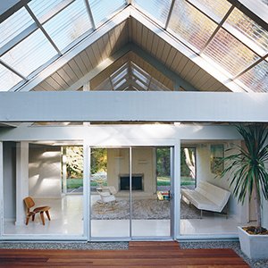 The literal and figurative centerpiece of this Portland home is the atrium. An LCW adds a natural touch to an otherwise white space.