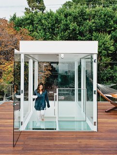 Dimster added new, two-story-tall beams to support the weight of the glass box topping the stair. "We were missing a grand outdoor space—that’s where the roof deck comes into play," Dimster says.