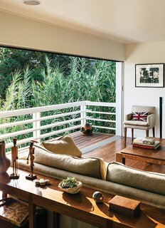 The team matched and continued the 1960s-era red oak floor into the living room, which gained an entire wall of new sliders from Western Window Systems. "We wanted to preserve the original intent of the house wherever we could," Dimster notes.