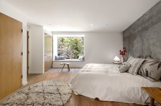 Inside, Storey chose to leave materials unfinished and as natural as possible — matte ceramic bathroom tiles, exposed concrete structural pillars and walls, and white-oak doors and floors. The latter were treated with WOCA, a VOC-free Danish floor oil.<br><br>"I left the concrete exposed to add texture — it’s a nice touch, because it’s something you’d normally see in much more high-spec houses," says Storey.
