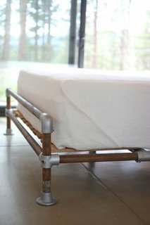 A Serene, Sustainable Home in Colorado - Photo 9 of 10 - Hirsh and Volny created a bed frame out of a rusted well pipe and scaffolding fittings.