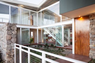 Paredes’s concept was to radiate rooms from a courtyard and join them with outdoor terraces—a move he borrowed from the traditional Moorish buildings he visited in Spain as a student. "It’s like a checkerboard of a house, where you have living spaces and patios between them," he says.