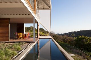 The back patio overlooks a swath of forest.