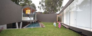 A Modern Concrete Home in Peru - Photo 8 of 13 - Lisette requested the central work island, which cantilevers over the pool.