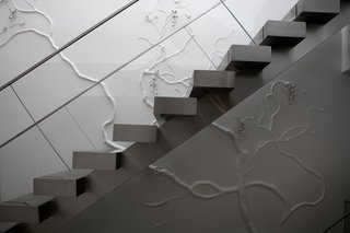Upon the revelation that a clients’ last names meant Wisteria in Japanese and Linden tree in German, Wiseman set to work creating an intertwined combination of the two plants stretching across four floors of the family’s home. An owl was later added to signify the couple’s son. Installation in a New York residence; Wisteria and Linden motif. Photo by: Sherry Griffin/R 20th Century.