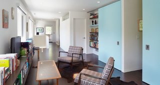 Custom powder-blue sliding doors on a track from Henderson lead to the kids' rooms.