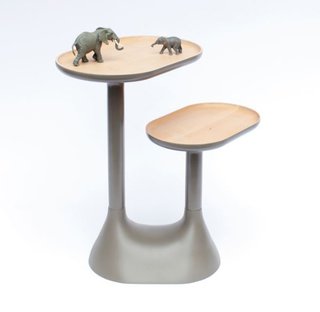 With a thick base and two rotating trays positioned at different heights, the lacquered lime-wood table can also function as a bedside table or decorative object. Photo by: Benjamin Graindorge