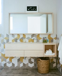 The second-floor bathroom's colorful Tex tiles from Mutina sport an array of different textures for a unique tactile experience.