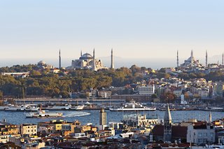 Looking at Istanbul’s old city from the trendy neighborhood of Beyoğlu, one can see the Hagia Sophia at left (rebuilt for the last time in the 6th century) and the 17th-century Sultanahmet (or "Blue") Mosque with its six minarets at right.