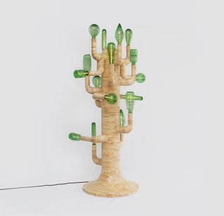 Inspired by the 1950's tropical modernism movement in Sao Paulo, Brazil , this light fixture stands 150cm tall and is made of fine pine offcuts and glass bottles.