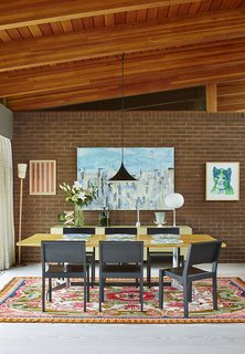 The dining room features a Glo-Ball T table lamp by Jasper Morrison.
