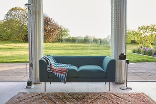 The loveseat is by Terence Woodgate.