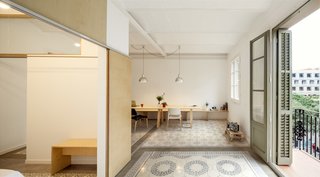 Barcelona-based architect Adrian Elizalde embarked on a renovation project for his family’s new apartment. His strategy was to inject some Scandinavian cool on a limited budget, using custom wood pieces and a sparse aesthetic to open things up. Lamps sourced from secondhand stores and a set of Belloch chairs by Santa & Cole are arrayed across the space.