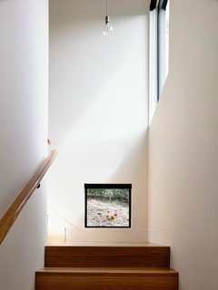 "I love this low-level stair window. It’s at head height when you’re at the bottom of the stairs; it gives you a glimpse of, and connection to, the garden outside. Most of the windows capture what I’d call ‘hero shots,’ but some, like this one, are completely unexpected."