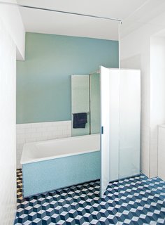 For the bathroom, Reckendorfer wanted a shower for daily use, but opted to keep a 1950s bathtub that she discovered in her basement. "I studied graphic design and photography, so visual things are so important to me," she says. "I love sleek, light-filled Scandinavian designs, but I also love flea markets and pieces with history."