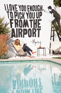 Classic butterfly chairs from Universal Patio Furniture are stationed by the pool. The mural is by street artist Morley, a close friend.