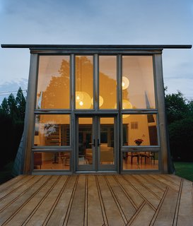 The historically protected property that Christine and James Boyle purchased on Long Island came with two existing shingled structures designed by modernist architect Andrew Geller in 1963. Bates Masi recast what was originally the primary residence as a guest cottage.