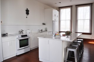 The updated kitchen boasts new cabinetry and appliances.