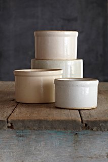 "Solid utilitarian stoneware with a zen neutrality. They are good for pickles, potted shrimp, duck rillette, or Yottam Ottolenghi's dip. Go ahead and bake in them, too."