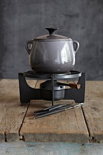 "The company Le Cousances, founded in 1553, was acquired by Le Creuset in 1957. This beautiful grey Le Cousances fondue set is immaculate and precious. It's perfect for a honeymoon in Alaska."
