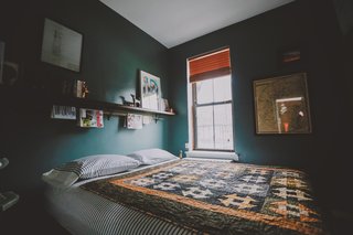 A bedroom is the best place to be moody. Use a saturated color (put down the off-white!) and a satin finish (preserves the light) on the walls—we promise you won't regret it. Photo by Chellise Michael Photography.